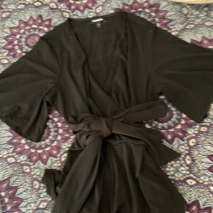 Express romper. Black can fit an s/m. Nice and flowy material, also has pockets.